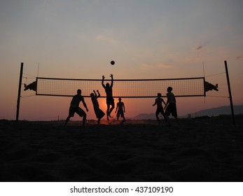 Beachvolley Game With Sunset Background