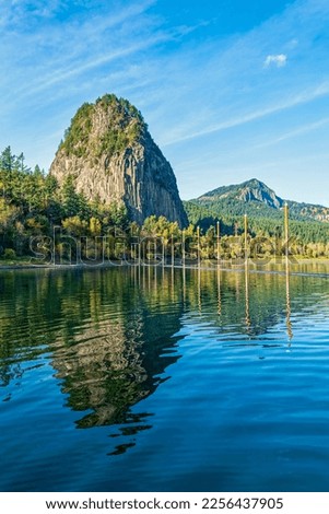 Beacon Rock and Hamilton Mountain reflected in the waters of the Columbia River at Beacon Rock State Park in Washington, USA
