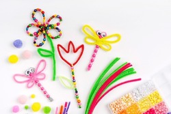 Beaded Pipe Cleaner Flowers And Dragonflies. Easy Spring Kids Crafts. Different Multi-colored Supplies And Materials For DIY Art Activity For Kids. Children's Crafts, Creativity And  Hobby. 