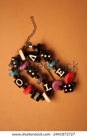 Beads with letters on dice - love