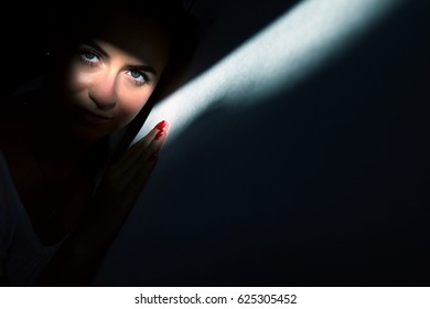 Beam Light Reflection On A Girl's Face