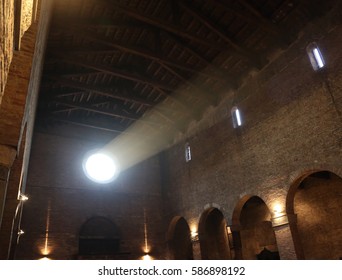 Beam Of Light That Penetrates From The Rose Window Into An Ancient Church