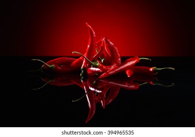 Beam Of Red Chilli Pepper On Black Background