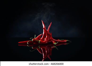 Beam Of Red Chilli Pepper On Black Background