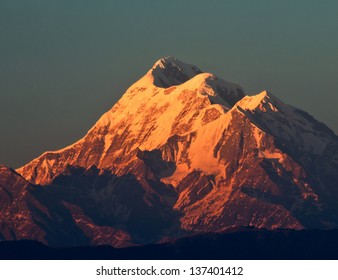 Beam Of Sun Light Illuminating Mountain With Three Peaks In Himalaya