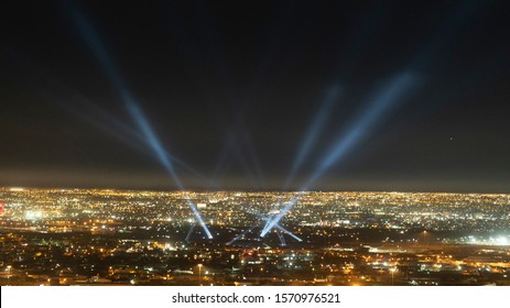 Beams Of Light From City Spotlights At Night