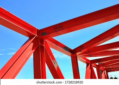 Beams Of The Red Bridge Are Made Of Steel On Blue Sky Background 