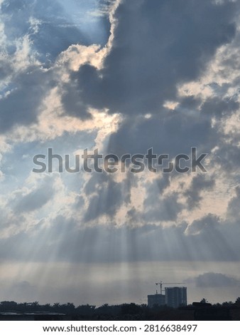 Beams of sun rays piercing through the clouds
