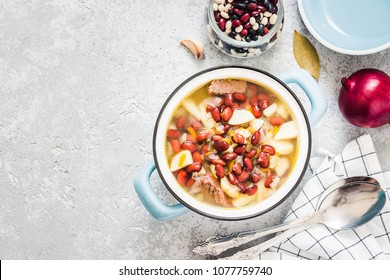 Bean Parmesan Spinach Soup In A Pot On Concrete Background. Top View, Space For Text.