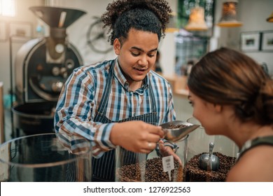 Bean Roasting Connoisseur Allowing Customer To Smell The Aroma From The Coffee Beans