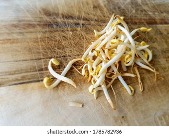 Bean sprouts on wooden cutting board