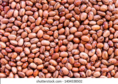 Beans of bean ( beans ).  Background of many grains of dried beans. Brown beans texture. Food background. Close up. Bean background and textured. Background of brown bean. Brazilian diet snack food. - Shutterstock ID 1404538502