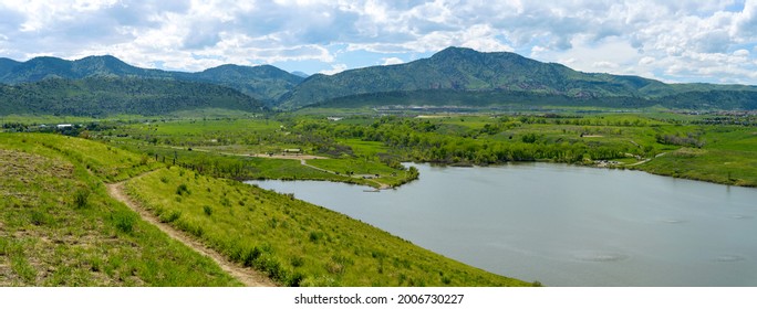 Bear Creek Lake - A panoramic Spring view of a biking trail winding at side of Mt. Carbon, overlooking Bear Creek Lake. Bear Creek Lake Park, Denver-Lakewood, Colorado, USA.