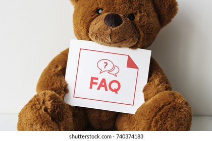 Bear doll with an FAQ card 