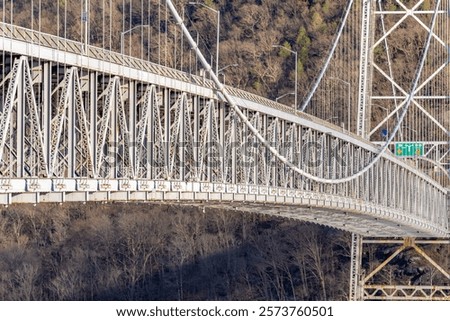 Bear Mountain Bridge, gray structural steel, located in the Hudson River valley, New York state.	