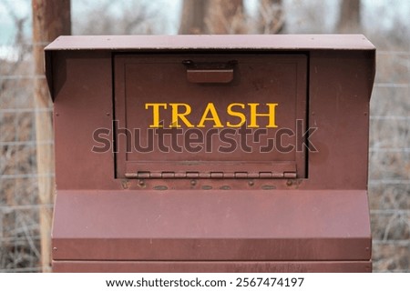 Bear proof trash container at park.  