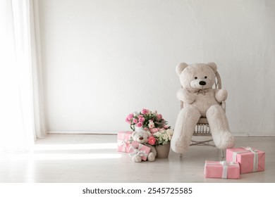 bear toy and flower gifts for a holiday in the interior of a white room - Powered by Shutterstock