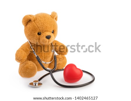 Bear toy and stethoscope. pediatrics medical concept isolated white