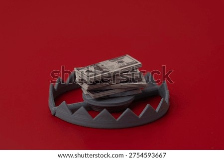 A bear trap set with a stack of US dollar bills. Financial traps, debt, risky investments, and economic danger concept.