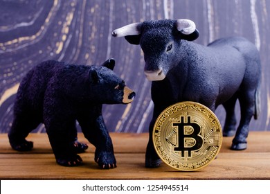 A Bear Trying To Take A Bitcoin From A Bull.