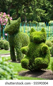 Bear And Unicorn Shaped Bushes In A Topiary Garden