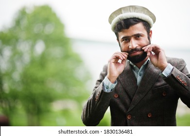 Beard Afghanistan Man Wear Pakol Hat And Jacket.