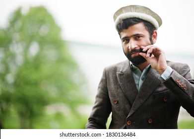 Beard Afghanistan Man Wear Pakol Hat And Jacket.