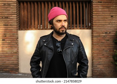 Beard Hipster Man Posing In Leather Jacket And Beanie Hat. Outdoor.