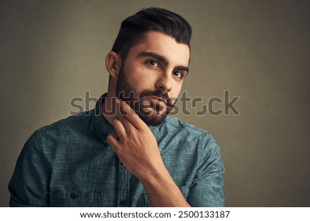 Beard, man and thinking in studio for style, date preparation and daily routine. Male person, grooming or hair care on dark background with confidence, natural product or growth management with pride