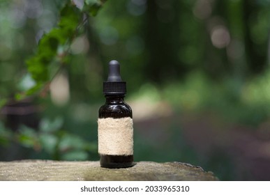 Beard Oil - Barbershop Product Photography. Bottle And Forest Fern. Empty Label - Mock-up.