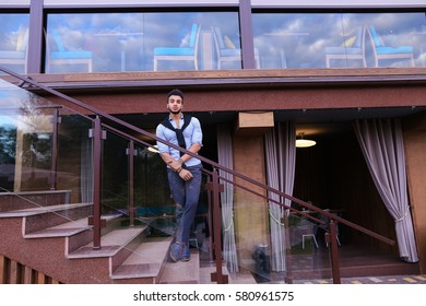 Bearded Arab Man, Businessman Students Gathered To Spend Time At Restaurant And Decided To Have Dinner, Arranged Business Meeting With Colleagues And Waits At Entrance To Restaurant, Smiling And