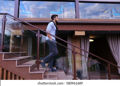 Bearded Arab Man, Businessman Students Gathered To Spend Time At Restaurant And Decided To Have Dinner, Arranged Business Meeting With Colleagues And Waits At Entrance To Restaurant, Smiling And