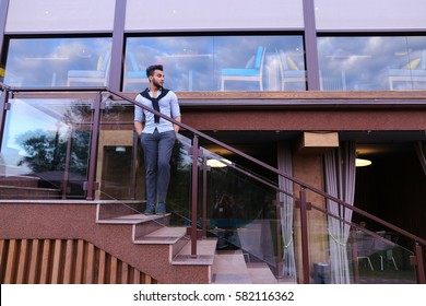 Bearded Arab Man, Businessman Students Gathered To Spend Time At Restaurant And Decided To Have Dinner, Arranged Business Meeting With Colleagues And Waits At Entrance To Restaurant, Smiling And