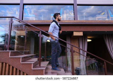 Bearded Arab Man, Businessman Students Gathered To Spend Time At Restaurant And Decided To Have Dinner, Arranged Business Meeting With Colleagues And Waits At Entrance To Restaurant, Smiling And