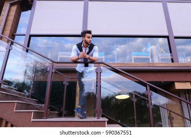 Bearded Arab Man, Businessman Students Gathered To Spend Time At Restaurant And Decided To Have Dinner, Arranged Business Meeting With Colleagues And Waits At Entrance To Restaurant, Smiling And