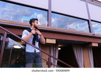 Bearded Arab Man, Businessman Students Gathered To Spend Time At Restaurant And Decided To Have Dinner, Arranged Business Meeting With Colleagues And Waits At Entrance To Restaurant, Smiling And