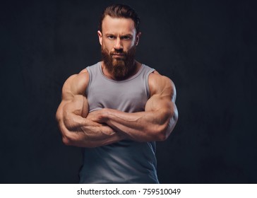 Bearded bodybuilder dressed in a tank top.