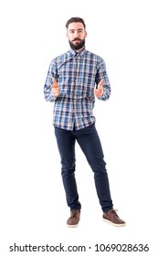 Bearded Business Man In Plaid Shirt Pointing With Amused Expression Looking At Camera. Full Body Isolated On White Background.