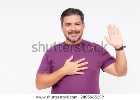 A bearded chubby man smiling while making a solemn oath. Wearing a purple waffle shirt. Half body photo isolated on white background.