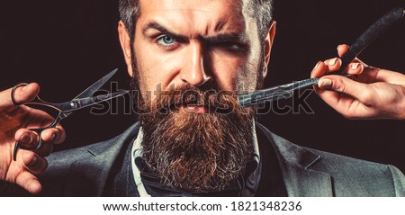 Bearded client visiting barber shop. Barber scissors and straight razor, barber shop, suit. Vintage barber shop, shaving. Portrait bearded man. Mustache men. Brutal guy, scissors, straight razor.
