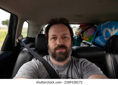 A Bearded Dad Takes A Selfie On A Road Trip On Summer Vacation.  Lifestyle Image Of A Candid Moment Of This Middle Aged Man.