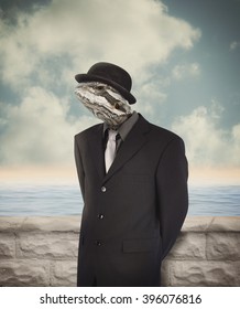 A Bearded Dragon Lizard's Head Is On A Business Man's Human Body With A Hat For A Humor Or Surreal Reality Concept.