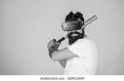 Bearded Gamer With Agitated Look Training Batting Skills, Simulation Game Concept. Man With Stylish Beard Posing With Baseball Bat Isolated On Gray Background. Bearded Man In VR Headset Doing Sports.