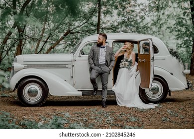 The Bearded Groom And Beautiful Bride. Retro Car.