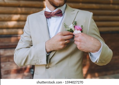 beige suit bow tie