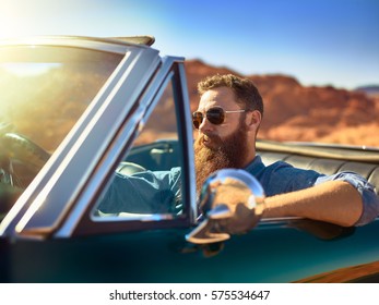 Bearded Guy In Desert Sitting In Cool Vintage Car Shot With Lens Lens