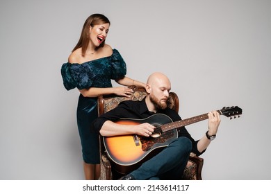 Bearded Guy Plays The Guitar. The Woman Sings A Song. Acoustic Duet.