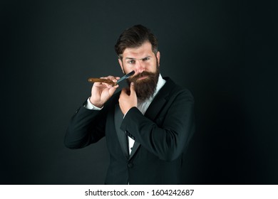 Bearded And Hairy. Bearded Man Hold Razor Dark Background. Businessman With Bearded Face. Unshaven Hipster Shave Facial Hair. Beard Trends. Bearded Or Clean Shaven. Barbershop. Barber Shop.