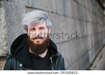 Similar – Man with gray hair and yellow turban.