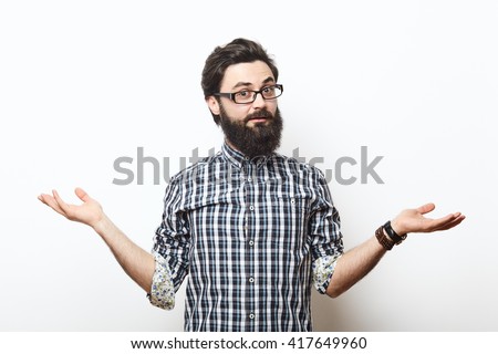 Bearded hipster young man wearing glasses doubting with his hands isolated on white background